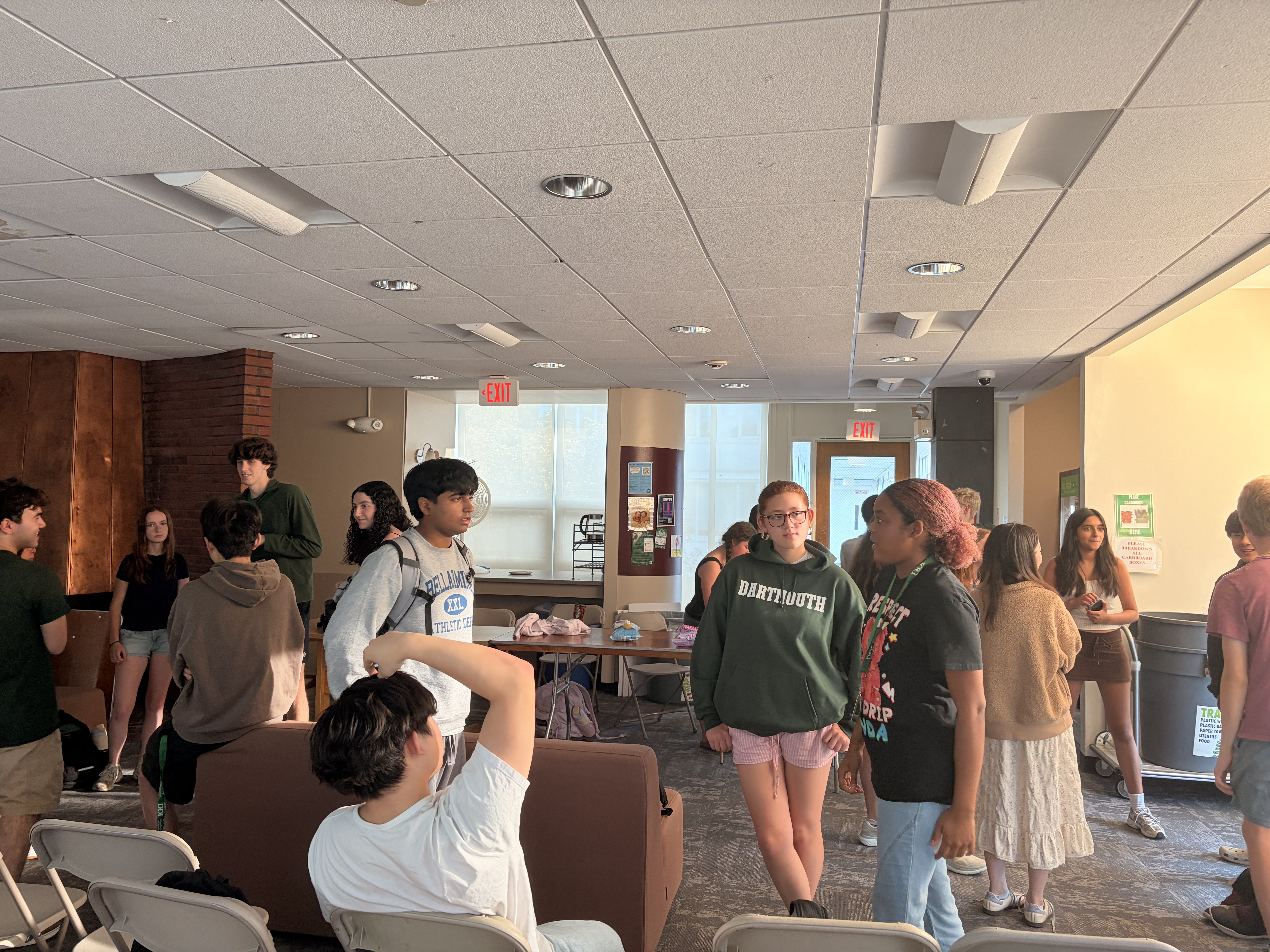 Debaters gathered together in a camp common area